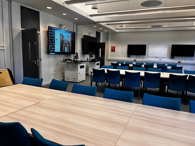 Canvas Central room showing screens and seating